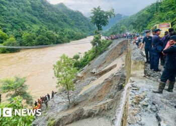 More than 60 missing as Nepal landslide sweeps buses into river
