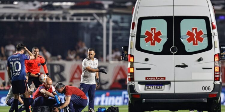 Nacional defender Izquierdo collapses on the pitch against Sao Paulo