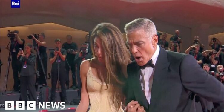 Clooney helps fallen photographer at Venice Film Festival