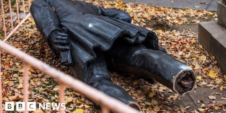 A severed statue divides an Australian city