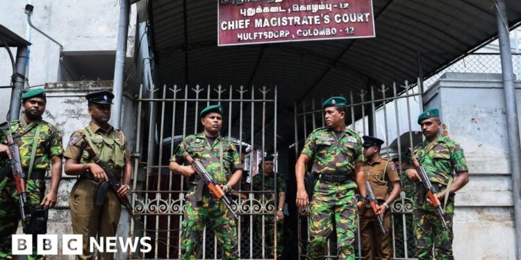 Gang leader shot dead in court by man disguised as lawyer