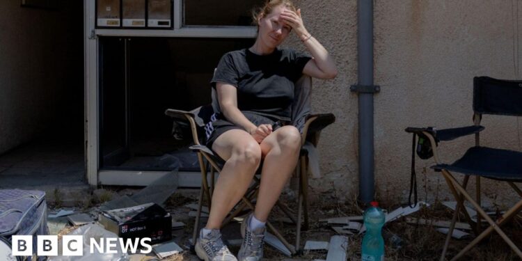 Israelis back conflict with Iran in neighbourhood struck by missile