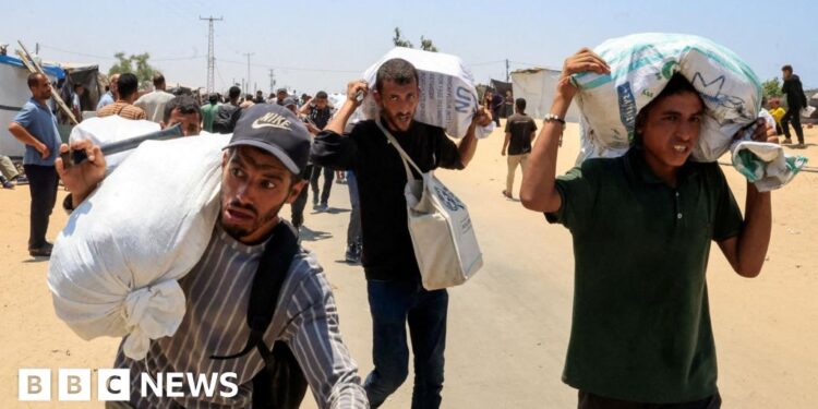 Palestinians say local gunmen and Israeli forces opened fire near Gaza aid site