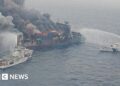 Four crew members missing as Singapore cargo ship burns off India coast