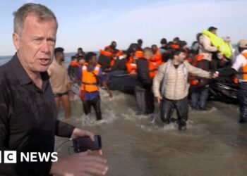 BBC on French beach as police slash migrant ‘taxi-boat’ heading to UK