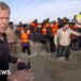 BBC on French beach as police slash migrant ‘taxi-boat’ heading to UK