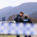 Australia police shooting suspect named as manhunt continues