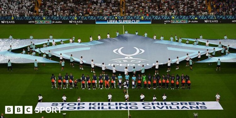 Uefa displays ‘stop killing children – stop killing civilians’ banner before Super Cup final