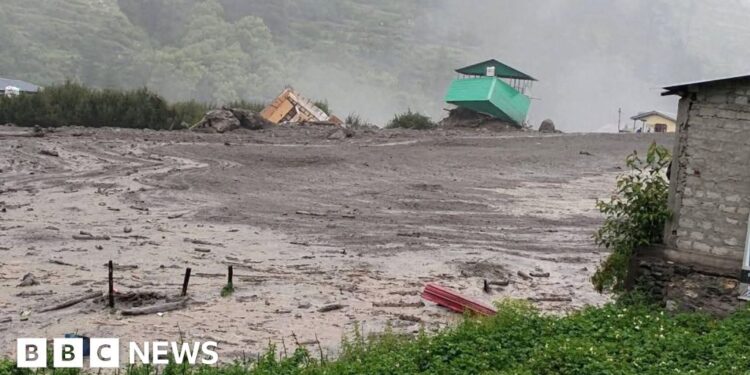 More than 100 people missing after flash floods hit village