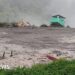 More than 100 people missing after flash floods hit village