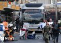 Six killed by Palestinian gunmen at Jerusalem bus stop