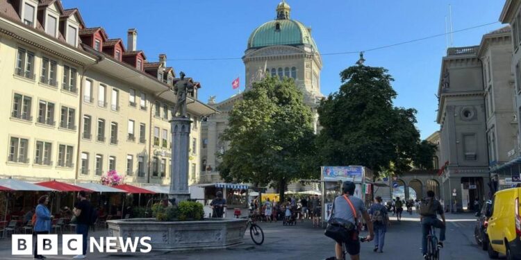 Swiss voters narrowly approve plan to introduce digital IDs