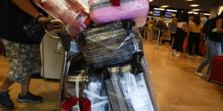 Does Wrapping Your Luggage in Plastic Actually Make It More Secure? We Asked TSA