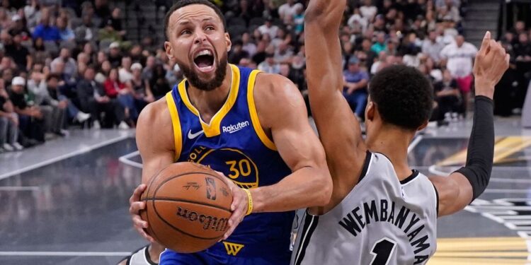 Curry torches Spurs again, rallies Warriors in 49-point night