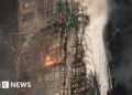 Firefighters search for missing in tower blocks fire