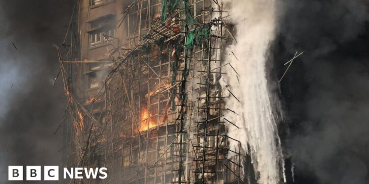 Firefighters search for missing in tower blocks fire