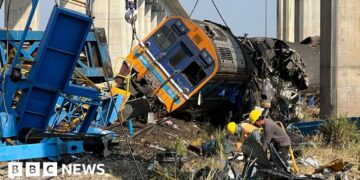 At least 32 dead after construction crane falls on train
