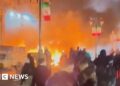 Buildings in Tehran set on fire as demonstrations spread across Iran