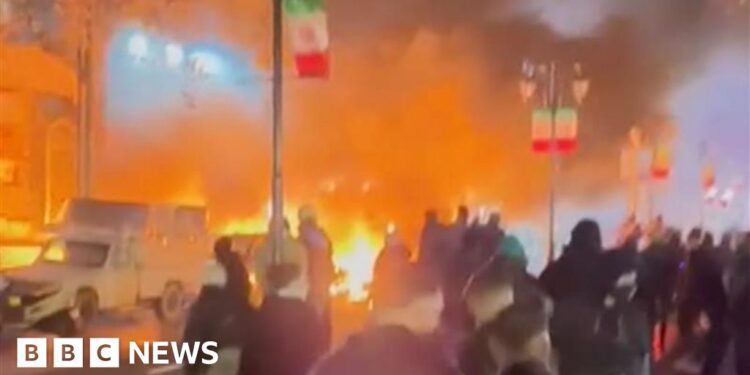 Buildings in Tehran set on fire as demonstrations spread across Iran