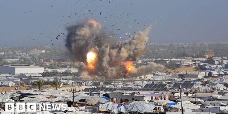 Israeli air strikes kill at least 32 Palestinians in Gaza, rescue officials say