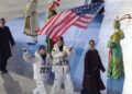 Italy throws farewell party, passes Olympic torch to France