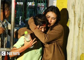 Police arrest gunman after two injured in school siege