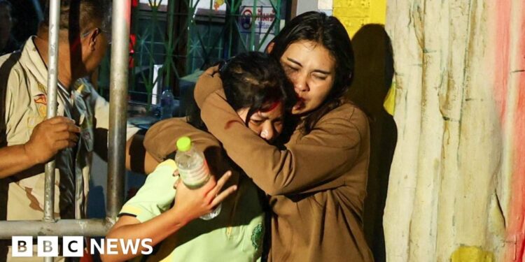 Police arrest gunman after two injured in school siege