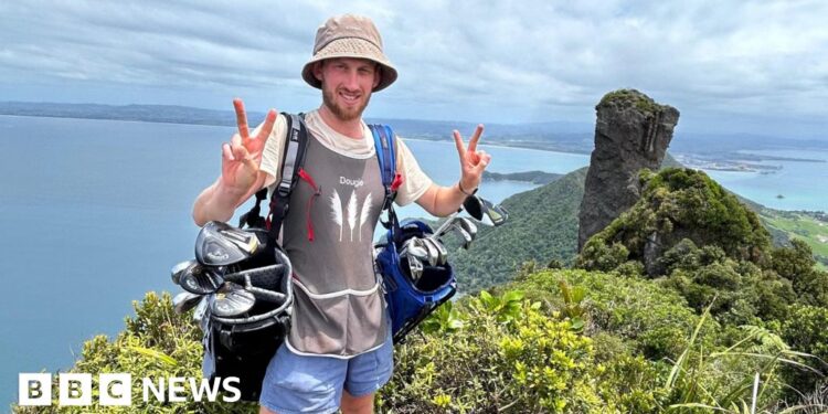 Golf caddy taking clubs length of New Zealand faces ‘hardest weeks’