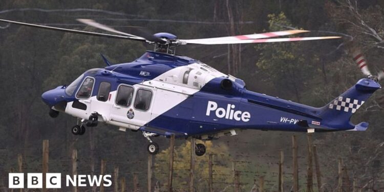 Shock, sadness and relief in town at centre of Australia's seven-month police manhunt