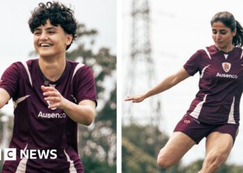 Why did only two Iranian football players stay in Australia?