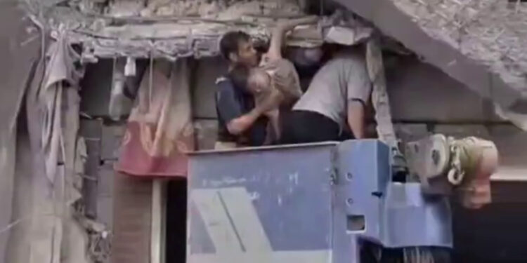 Rescue workers rush to save lives after south Tehran missile strike | Conflict