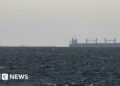 Strait of Hormuz closed again, Iran says, as ships attacked