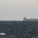 Strait of Hormuz closed again, Iran says, as ships attacked