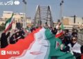 Iranians form human chains at bridges and power plants