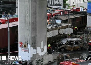 Freight train and bus crash kills at least eight in Bangkok