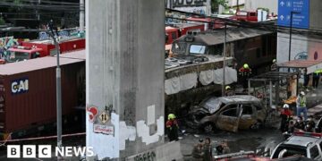 Freight train and bus crash kills at least eight in Bangkok
