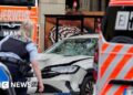 Two killed and many injured after car driven into crowd in German city of Leipzig