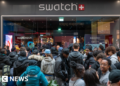 Swatch shuts stores after crowds queue for new watch